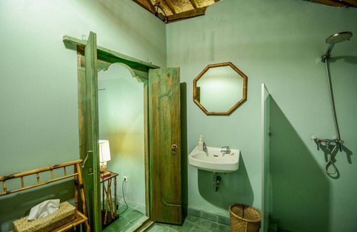 Jasri Resort | Romantic Private Villa facing the pool.Soft aqua handmade tiles and antiques.